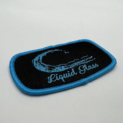 Kundenspezifischer Markenname Logo Patches Iron On Patches mit blauer Merrowed-Grenze